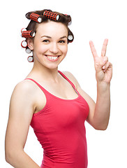 Image showing Woman is showing victory sign