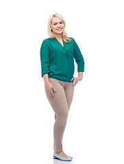 Image showing smiling young woman in shirt and trousers