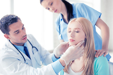 Image showing male plastic surgeon with patient