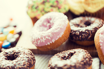 Image showing close up of glazed donuts pile on table