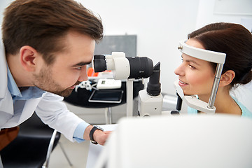 Image showing optician with tonometer and patient at eye clinic