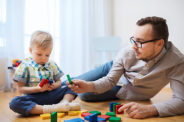 Image showing father and son playing with toy blocks at home