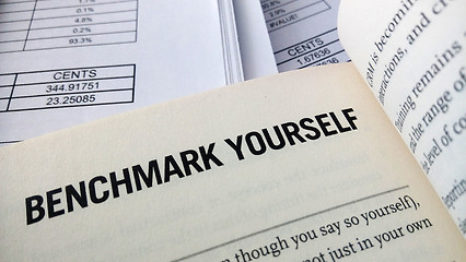 Image showing Benchmark yourself word on the book 