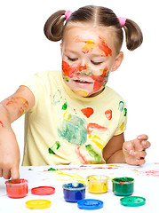 Image showing Portrait of a cute girl playing with paints