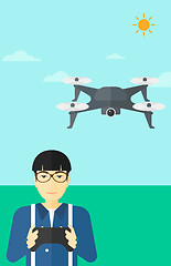 Image showing Man flying drone.