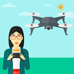 Image showing Woman flying drone.