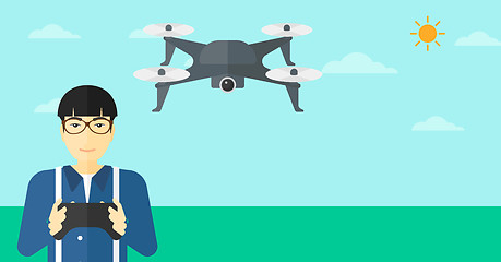 Image showing Man flying drone.