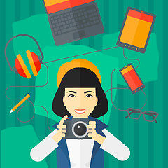 Image showing Woman holding camera.