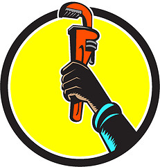 Image showing Black Plumber Hand Raising Monkey Wrench Circle