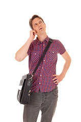 Image showing Young man talking on phone.