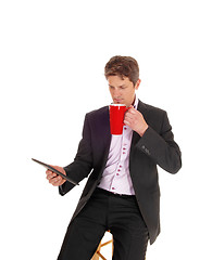 Image showing Businessman drinking coffee.