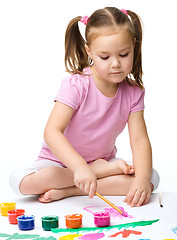 Image showing Cute cheerful child play with paints