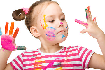 Image showing Portrait of a cute girl playing with paints