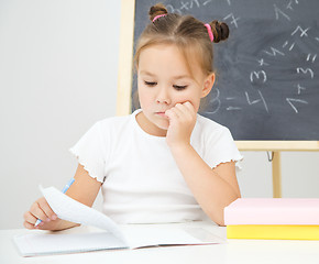 Image showing Little girl is studying