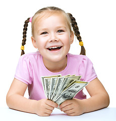 Image showing Little girl with dollars