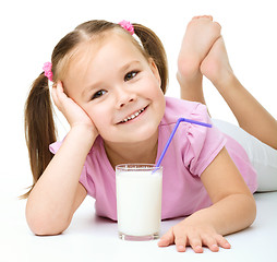 Image showing Cute little girl with a glass of milk