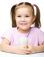 Image showing Cute little girl with a glass of milk