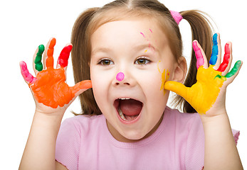 Image showing Portrait of a cute girl playing with paints