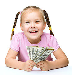 Image showing Little girl with dollars