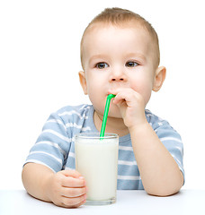 Image showing Cute little boy with a glass of milk