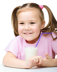 Image showing Cute little girl with a glass of milk