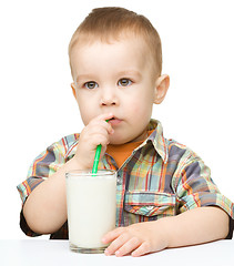 Image showing Cute little boy with a glass of milk