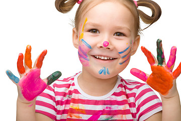 Image showing Portrait of a cute girl playing with paints