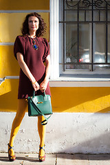 Image showing beautiful woman in a burgundy dress