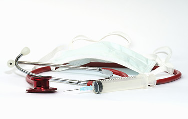 Image showing Stethoscope, syringe and a mouth protection