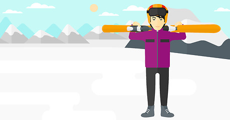 Image showing Man holding skis.