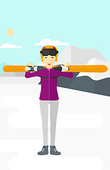 Image showing Woman holding skis.