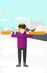 Image showing Man holding skis.