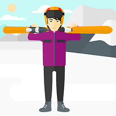 Image showing Man holding skis.