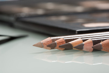 Image showing shadows eye and eyebrow set on table