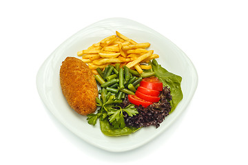 Image showing chicken cutlet with vegetables and garnish