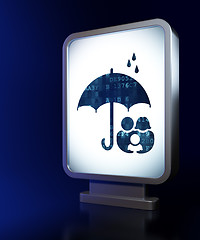 Image showing Safety concept: Family And Umbrella on billboard background