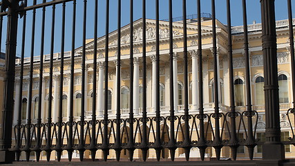 Image showing  high iron fence in front of palace