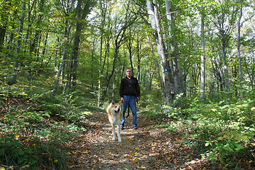Image showing Man and dog enjoying in the forest