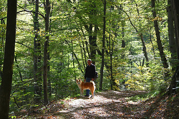 Image showing Man and dog enjoying in the forest