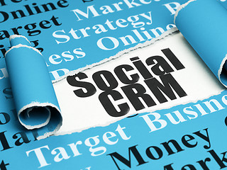 Image showing Marketing concept: black text Social CRM under the piece of  torn paper