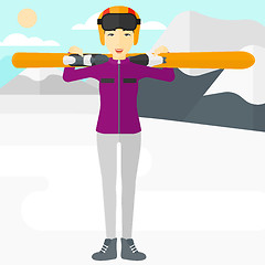 Image showing Woman holding skis.