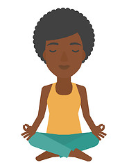 Image showing Woman meditating in lotus pose.