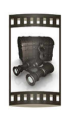 Image showing binoculars and chest. The film strip