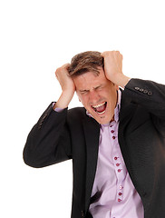 Image showing Screaming man scratching his head.