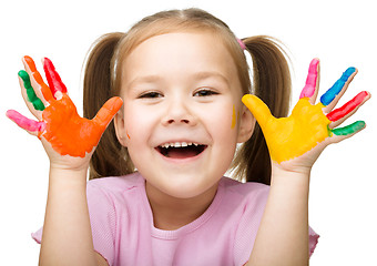 Image showing Portrait of a cute girl playing with paints