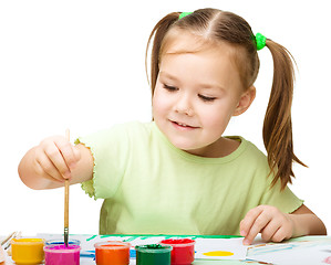 Image showing Cute cheerful child play with paints