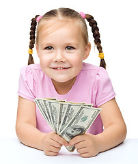 Image showing Little girl with dollars