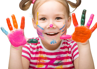 Image showing Portrait of a cute girl playing with paints