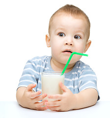 Image showing Cute little boy with a glass of milk