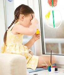 Image showing Portrait of a cute girl playing with paints